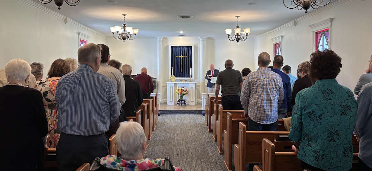 Pastor Tim Graham reading our Dedication Prayer